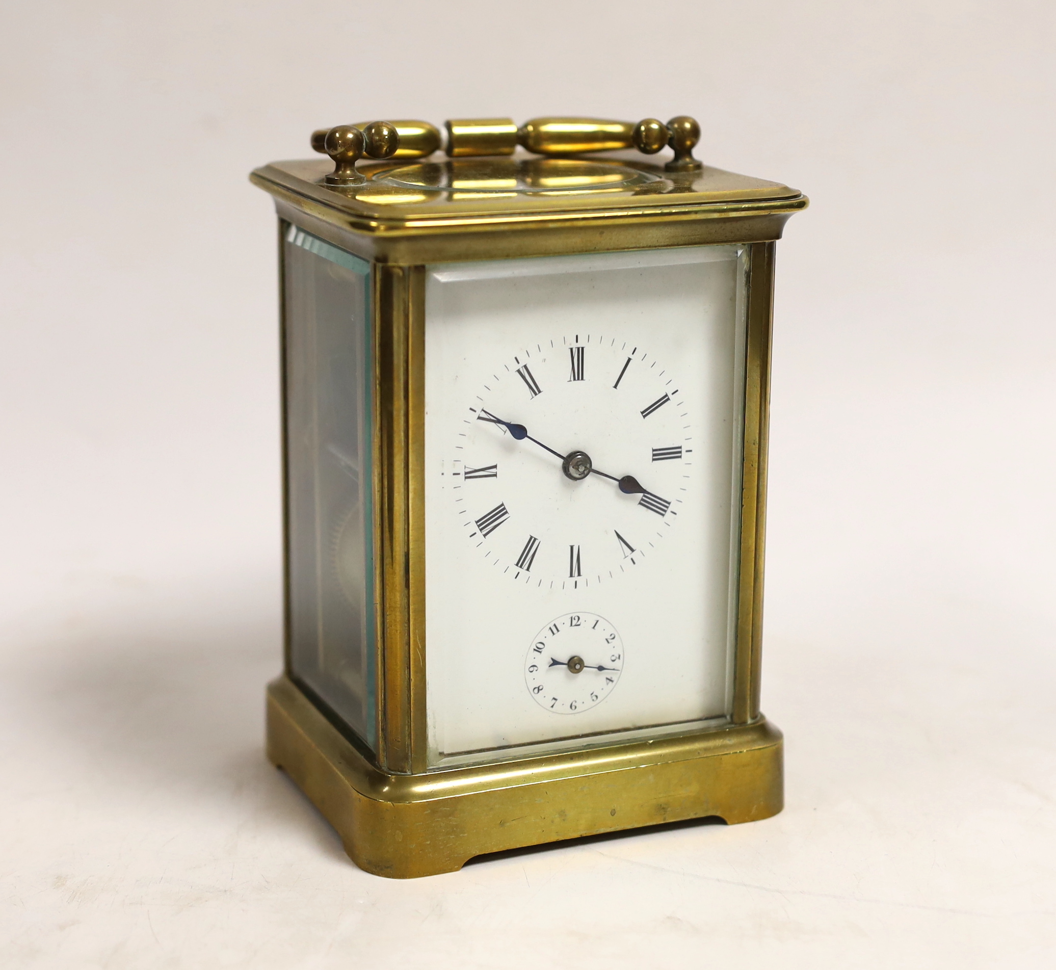 A late 19th century French carriage clock, with alarm, portable in case, clock 14cm high